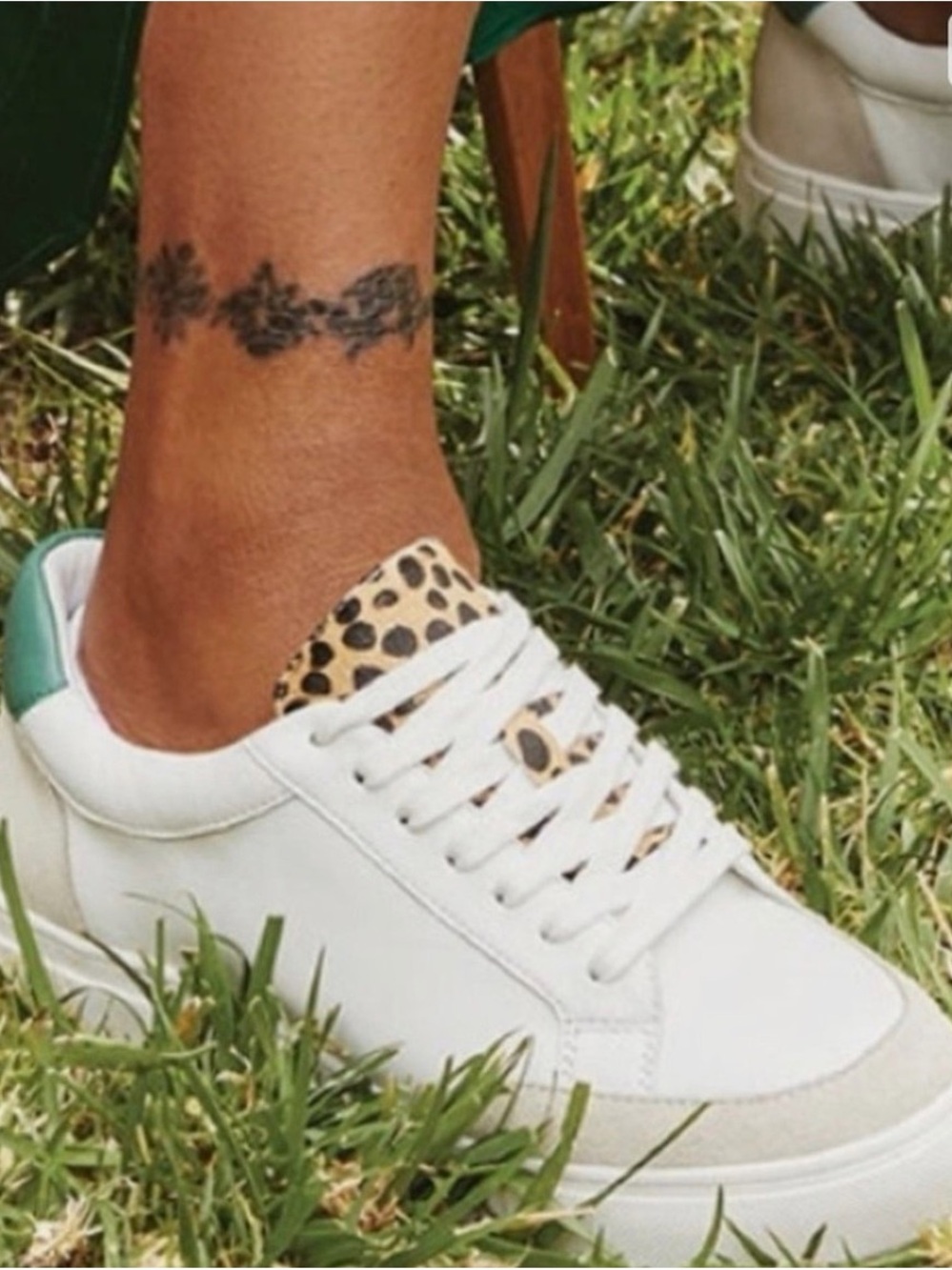 Birdies Women’s White Sneaker with Leopard Tongue and Green Heel Accent
